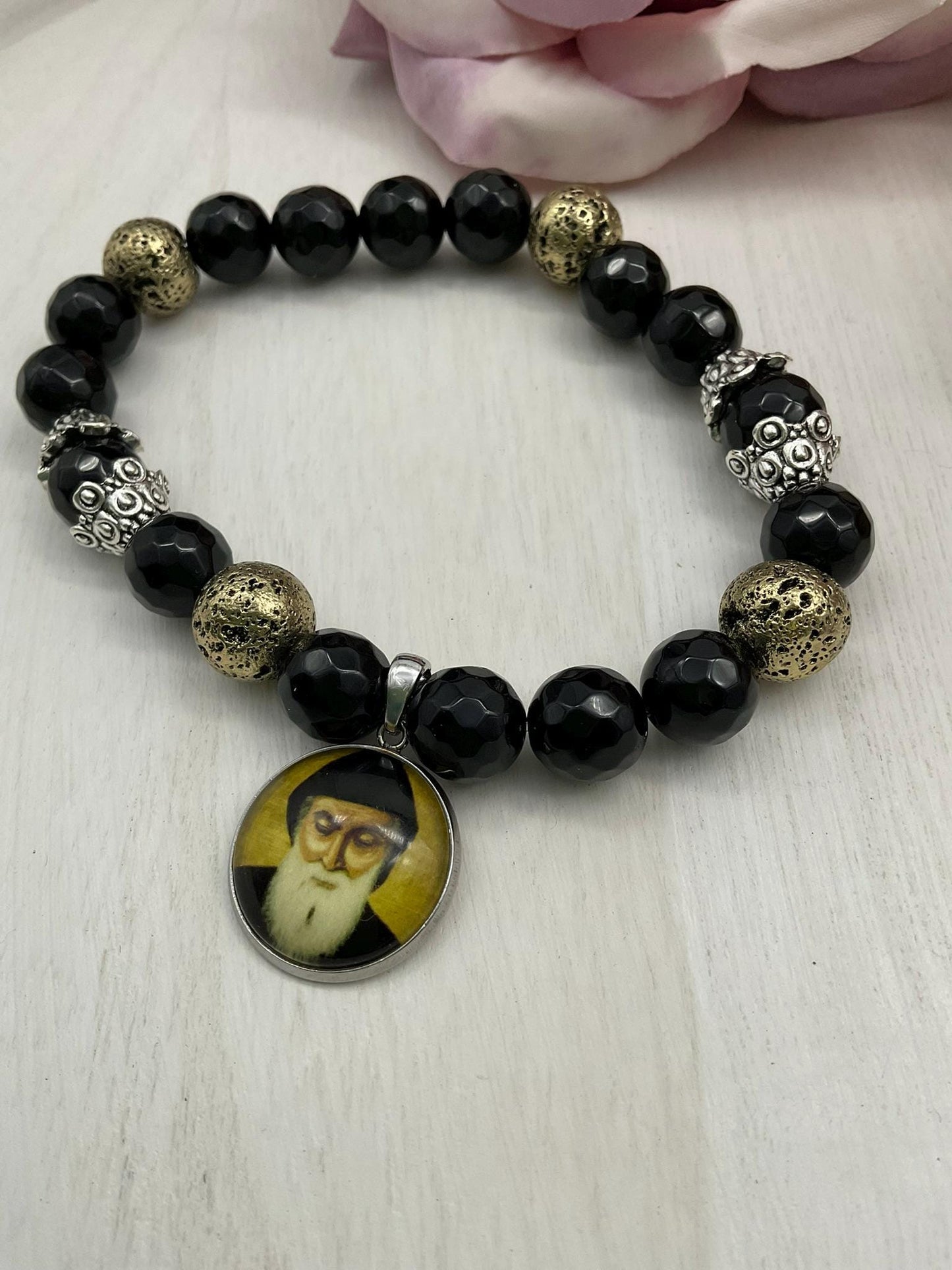 St Charbel Catholic Stretch Bracelet | Black Onyx and Gold Lava Stone Saint Charbel Charm Pendant