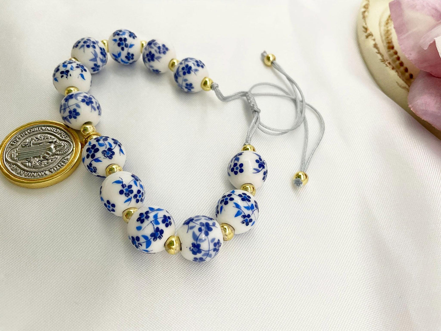 Saint Benedict Pendant Charm Bracelet - Porcelain Beaded Catholic Bracelet, Blue and White Floral Design, Adjustable Cord 18K Gold Plated