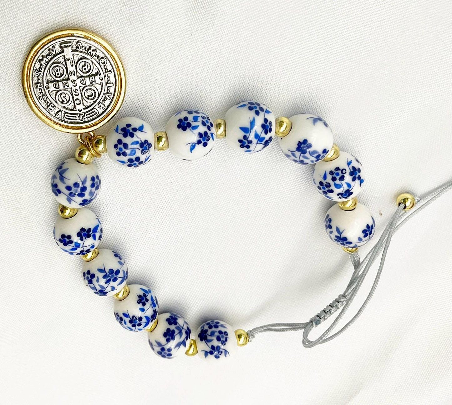 Saint Benedict Pendant Charm Bracelet - Porcelain Beaded Catholic Bracelet, Blue and White Floral Design, Adjustable Cord 18K Gold Plated