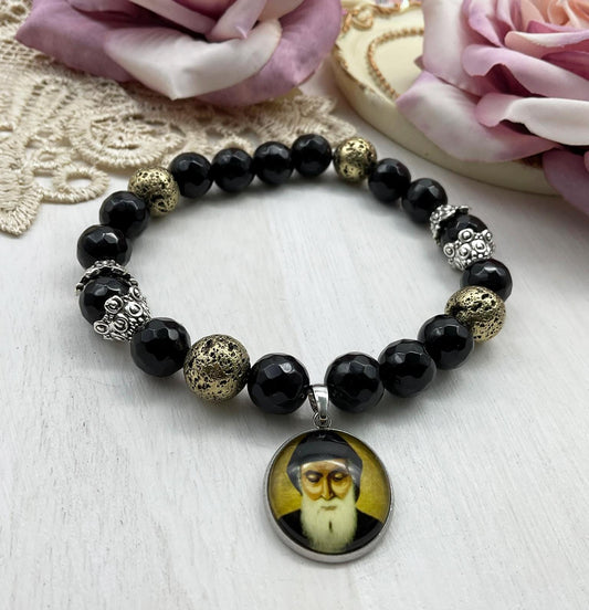 St Charbel Catholic Stretch Bracelet | Black Onyx and Gold Lava Stone Saint Charbel Charm Pendant